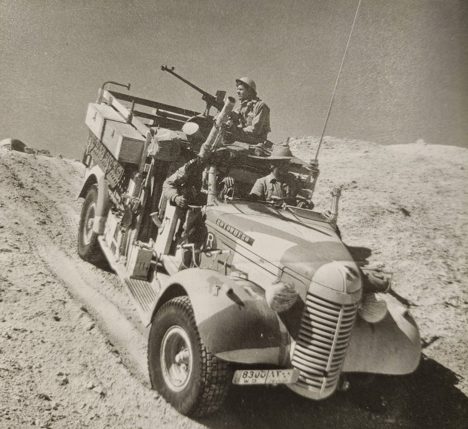 The LRDG wireless truck Rotowhero in the desert, its tall rod aerial raised