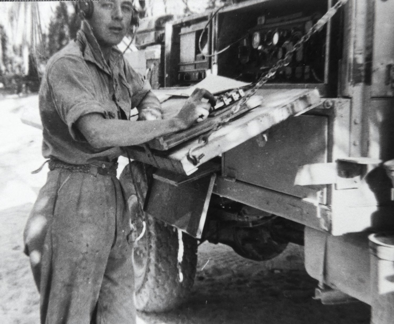 Signalman T. Scriven at a wireless set mounted on an F30 truck