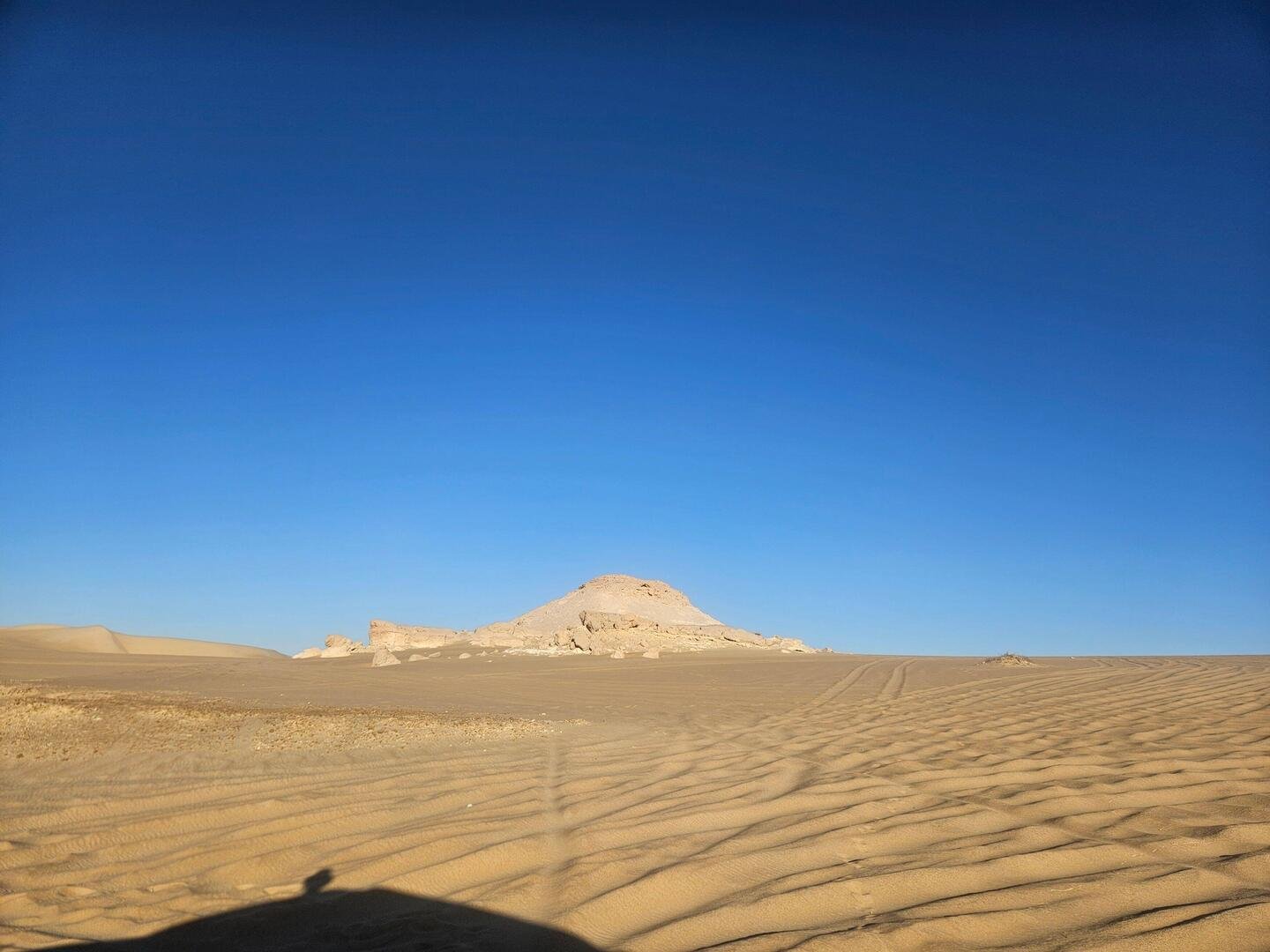 A rocky jebel rising from the desert